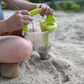 Kreativ sandleksak i konform för strandlek